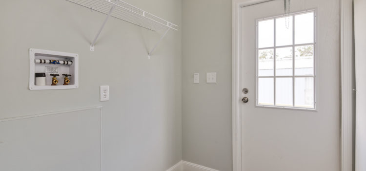 Utility room with washer/dryer hook-ups