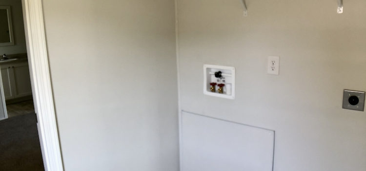 Utility room with washer/dryer hook-ups