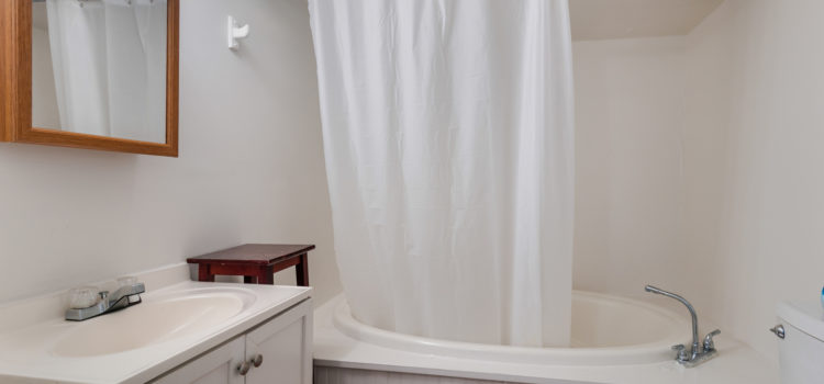Bath with soaking tub